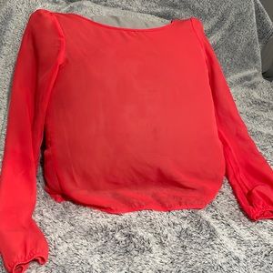 Coral sheer long sleeve top with a cut out design on the back
